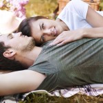 A man and woman laying on the ground