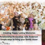 A family is holding leaves in the air.